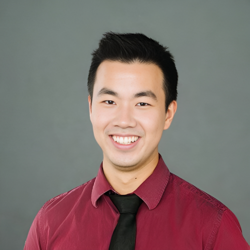 Optometry professional from Lethbridge Vision Care smiling in a studio portrait, committed to quality eye health and patient care.